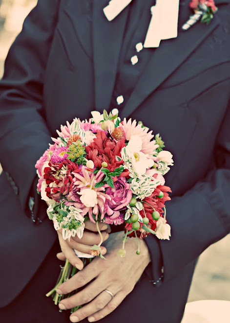 the groom with bride's bouquet