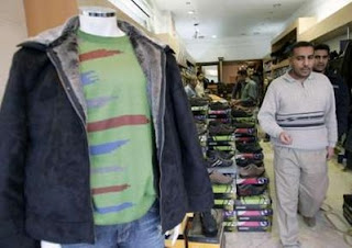 Residents shop for clothes and shoes in Baghdad's Karrada commercial district December 8, 2007