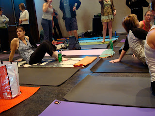Various people on yoga mats
