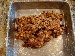 Lined pan with Vegan Peanut Butter Chocolate Chip Protein Bar dough dolloped inside