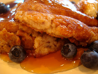 Up close of pancakes with dripping syrup