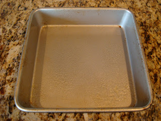 Lightly greased baking pan on stove