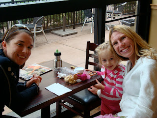 Two woman and young girl smiling for camera