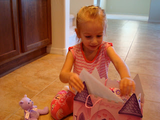 Young girl opening birthday presents
