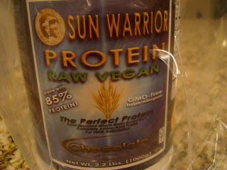 Close up of Sun Warrior Raw Vegan Brown Rice Protein Powder in Chocolate - 49
