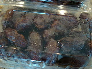 Bottom side of container of dates - 9