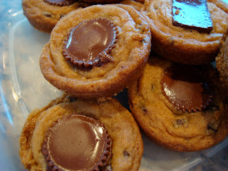 Non-Vegan Chocolate Chip Cookies with Reese's Cup Centers in clear container