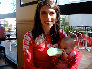 Woman holding baby drinking bottle