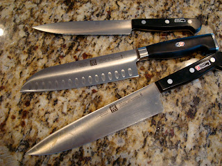 Three knives on countertop