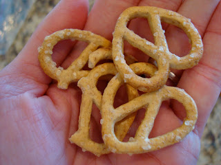 Hand holding pretzels