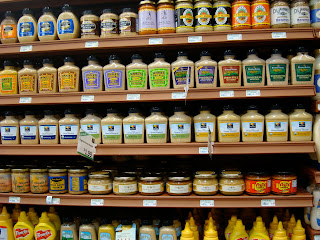 Shelves full of various mustards