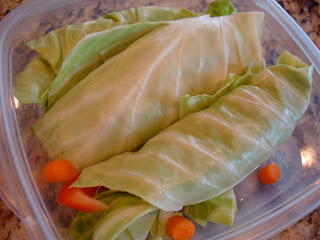 Raw Vegan Cabbage Wraps in clear container