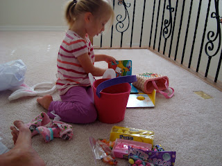 Young girl sitting on floor playing with toys