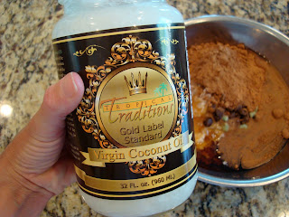 Hand holding coconut oil container - 77