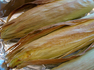Close up of corn husks in baking pan