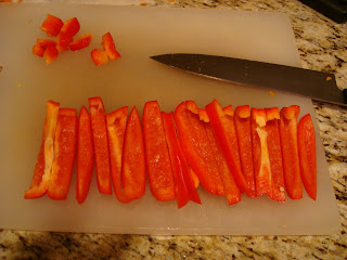 Sliced red peppers on cutting board