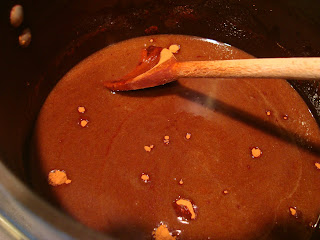 Buttery spread, brown sugar and water melted in pot