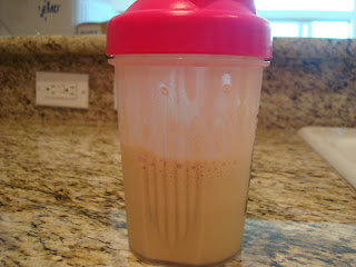 Brown Rice Protein Powder mixed with water in shaker bottle
