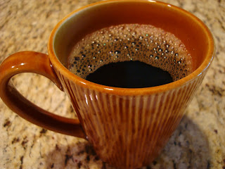 Brown mug of brewed coffee