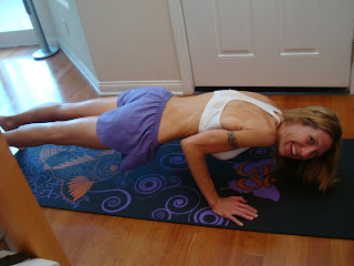 Woman doing chaturanga yoga pose