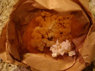 Popped popcorn in paper bag