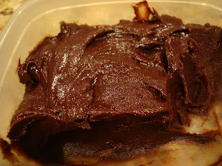 Raw Vegan Brownies in clear container with some eaten - 25