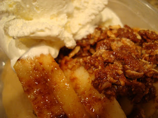 Close up of Apple Crumble topped with Whipped Cream