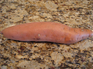 Long skinny sweet potato on countertop