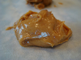 One Raw Vegan Peanut Butter Cookie Dough Ball on parchment paper