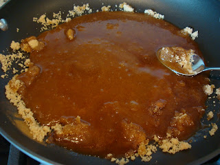 Spoon stirring Vegan Banana Foster ingredients in pan while melting