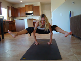 Woman doing Tittibhasana yoga pose - 25