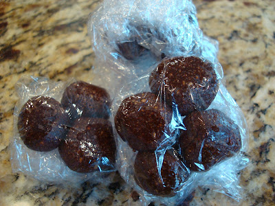 Raw Vegan Chocolate Peppermint Donut Holes wrapped in plastic wrap