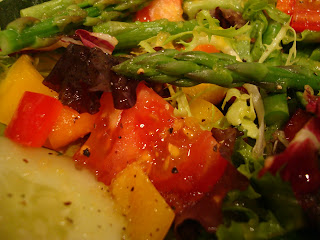 Greens salad with mixed vegetables in homemade dressing