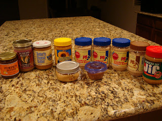 Countertop full of various nut butters