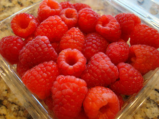 Raspberries in clear container