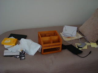 Contents of desk placed on bed