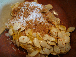 Squash seeds with pumpkin pie spice and salt in bowl
