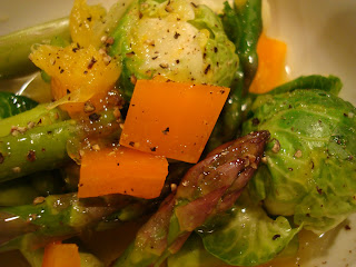 Mixed vegetables in dressing in white bowl