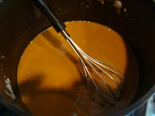 Vegan No-Bake Pumpkin Pie filling ingredients in pot on stove being whisked