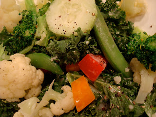 Kale Salad with Mixed Vegetables with Homemade Dressing in white dish