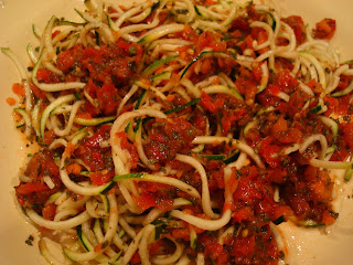 Raw Zucchini Pasta and Raw Marinara mixed up on plate