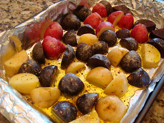 Tri colored potatoes on foil lined baking sheet