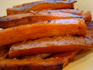 Stacked Sweet Potato Fries on white plate
