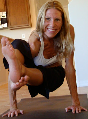 Woman doing Astavakrasana Variation yoga pose