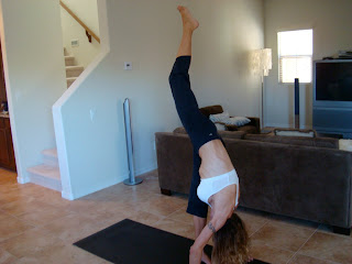 Woman doing Urdhva Prasarita Eka Padasana yoga pose