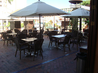 Outdoor cafe seating with umbrellas