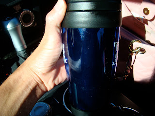 Hand holding coffee in to-go cup - 41