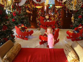 Young girl in open air lobby decorated in Christmas Theme - 43