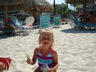 Young girl in bathing suit playing in sand - 5