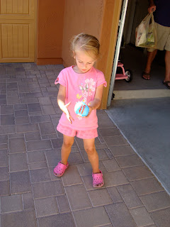 Young girl holding blue ball